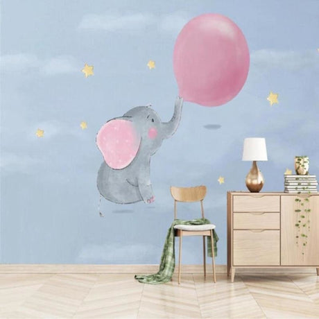 Elephant nursery wallpaper with pink balloon creating a cozy atmosphere in a modern white nursery with wooden furniture