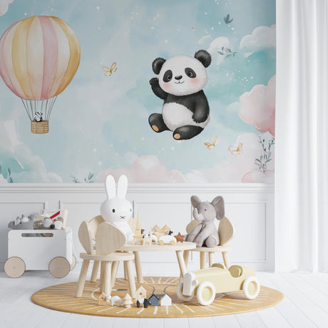 Flying Panda wall mural brightens a modern nursery with soft pastel colors and whimsical hot air balloon design