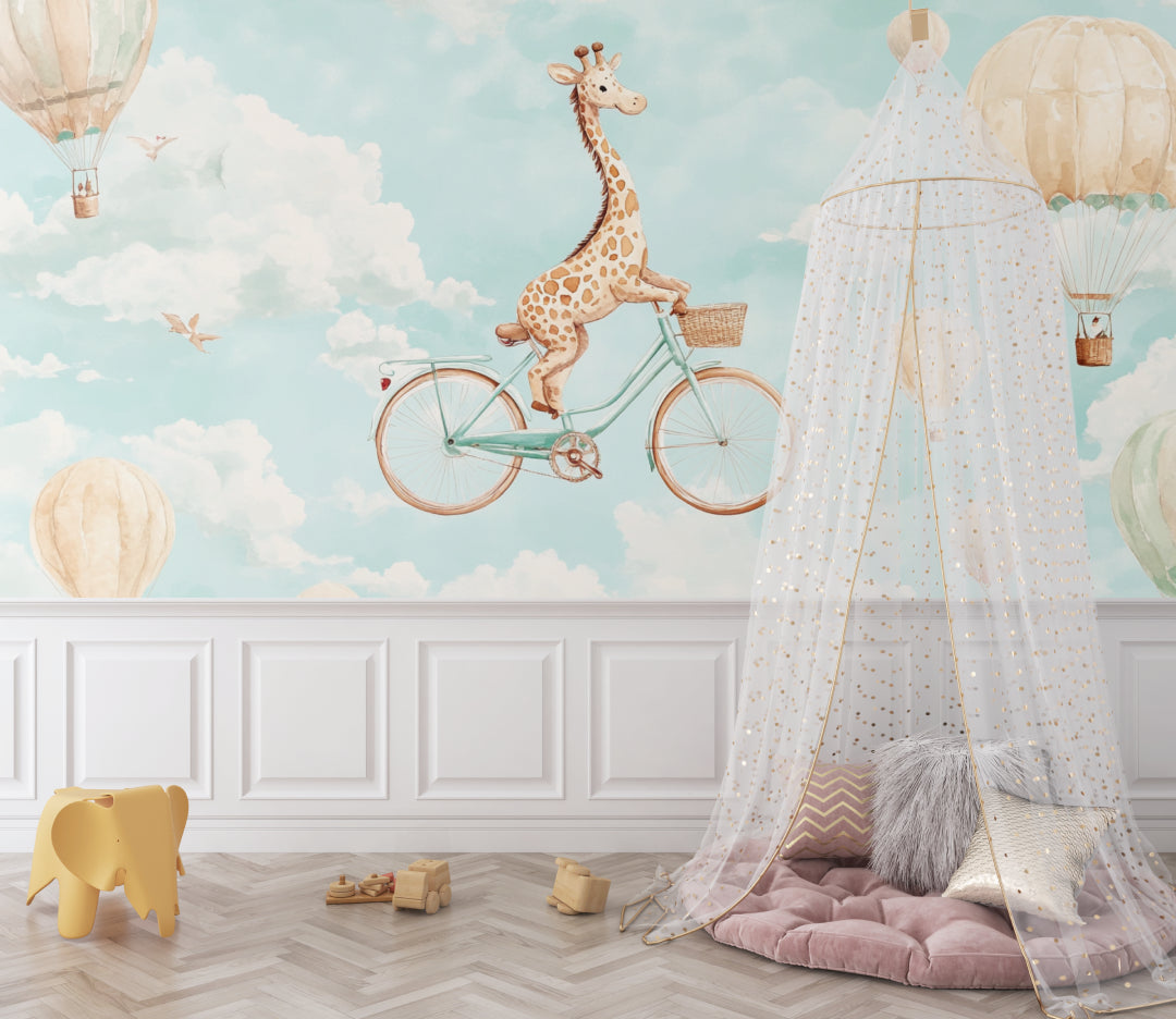 Kids bedroom with playful giraffe and balloon wallpaper next to a reading nook