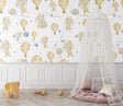Hot air balloon nursery wallpaper in a bright modern nursery with white furniture