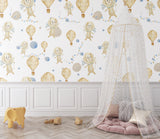 Hot air balloon nursery wallpaper in a bright modern nursery with white furniture