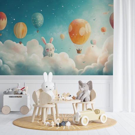 Hot air balloon wallpaper with bunny design shown in a bright nursery with white furniture