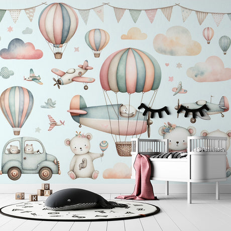 Hot air balloon nursery wallpaper with teddy bears shown in a bright kids bedroom with white furniture and natural light