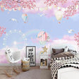 Hot air balloon wallpaper with cherry blossoms creating a magical atmosphere in a bright nursery room