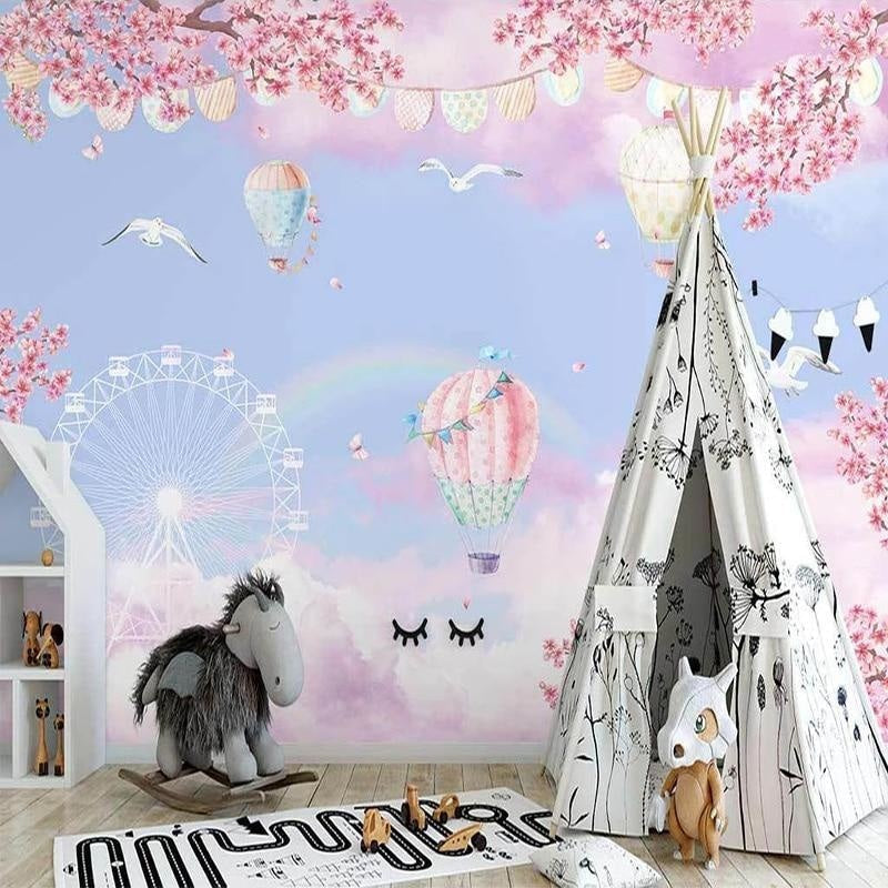 Playroom decorated with dreamy hot air balloon and cherry blossom wallpaper in soft pastels