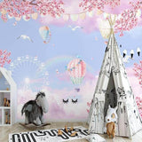 Playroom decorated with dreamy hot air balloon and cherry blossom wallpaper in soft pastels