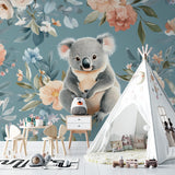 Sweet koala wallpaper featured in modern playroom with reading nook and soft furnishings