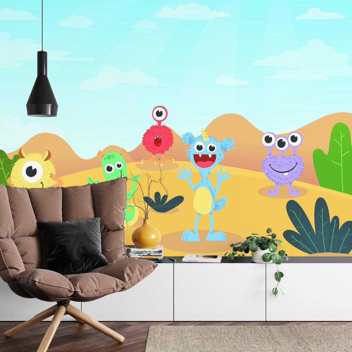 Cheerful monster wall mural displayed in modern nursery with white furniture