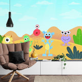 Cheerful monster wall mural displayed in modern nursery with white furniture