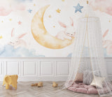 Dreamy bunny wall mural in a Scandinavian style kids bedroom with white furniture