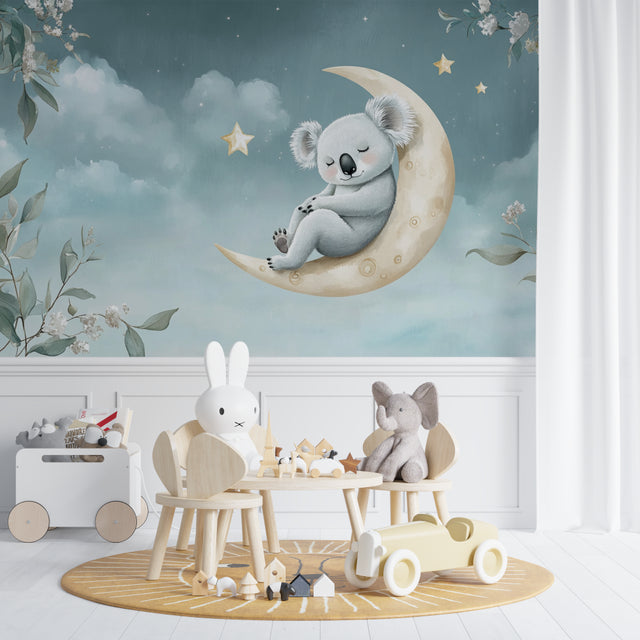Koala nursery wallpaper creating a peaceful atmosphere in a modern white nursery with wooden furniture