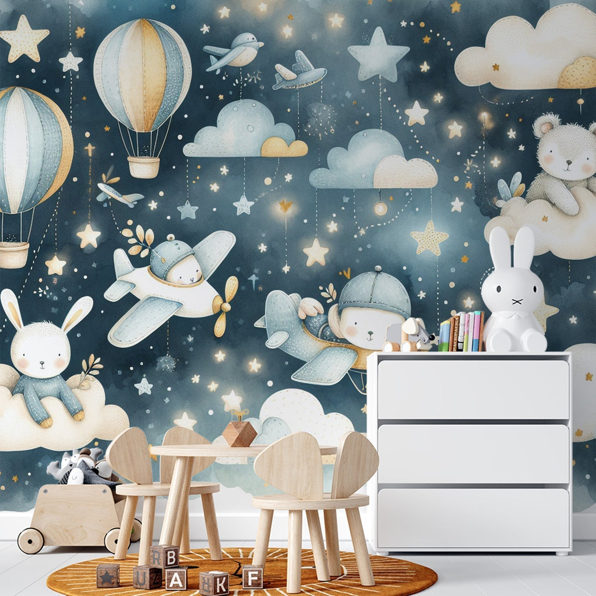 Dreamy nursery wallpaper with flying animals and stars shown in a cozy children's bedroom with soft lighting