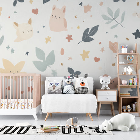 Sweet animal nursery wallpaper creating a cozy atmosphere in a modern white nursery with natural wood furniture