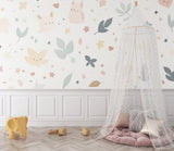 Animal wall mural in a playful toddler's bedroom with reading nook and soft lighting