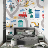 City adventure wallpaper transforming a nursery with its fun vehicle design and soft colors