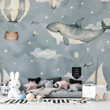Kids bedroom with Whale Adventure wallpaper showing playful hot air balloons and gentle marine theme