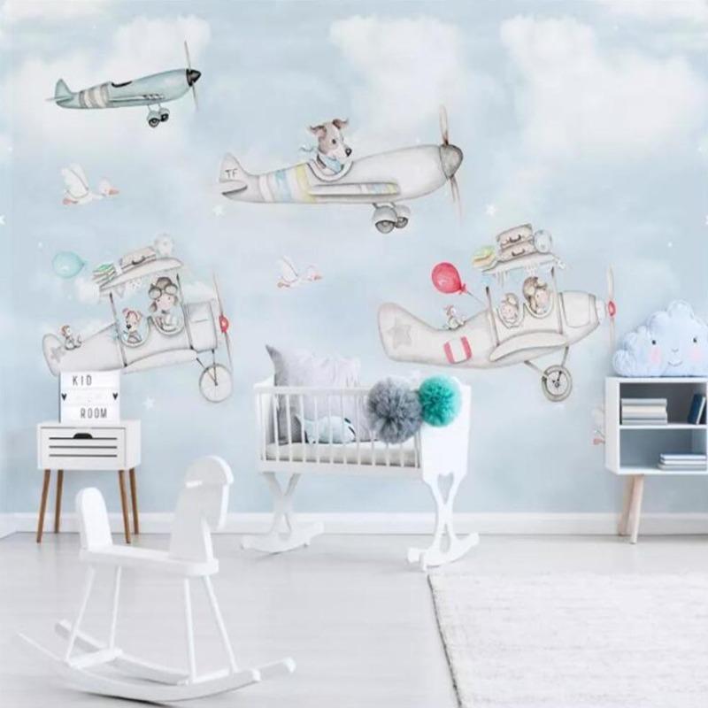 Flying animals wallpaper creating a magical atmosphere in a bright nursery with white furniture and natural light