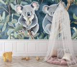 Reading nook with koala eucalyptus forest wallpaper creating a cozy learning corner