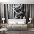 Black and white koala wallpaper creating a serene atmosphere in a modern living room with minimalist furniture