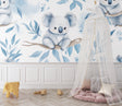 Koala nursery wallpaper bringing calm to a modern nursery with rocking chair and natural decor