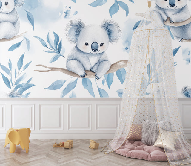 Koala nursery wallpaper bringing calm to a modern nursery with rocking chair and natural decor