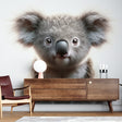 Koala wall mural creating a peaceful atmosphere in a modern nursery with white furniture and natural wood accents