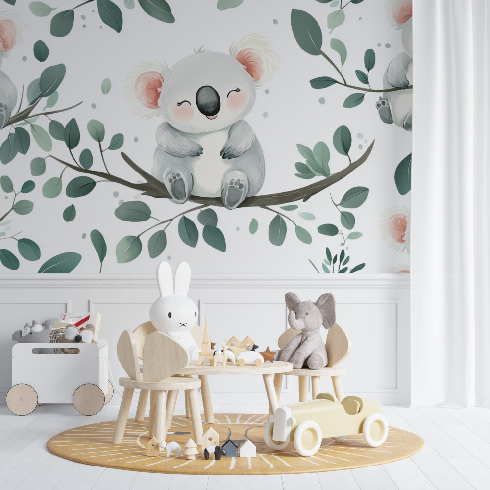 Koala nursery wallpaper in a modern baby room with white furniture and natural light