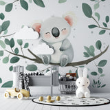 Sweet koala wallpaper creating a reading nook in a toddler's bedroom
