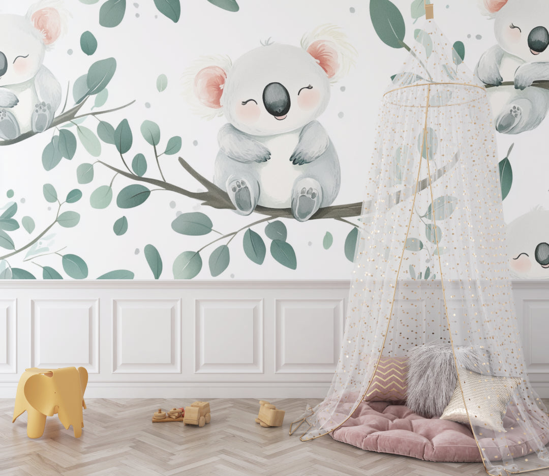 Nursery wall mural with koalas and eucalyptus leaves in a playroom setting