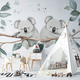 Sweet koala wall mural in a child's reading nook with cozy cushions and soft lighting