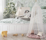 Australian wildlife wallpaper creating a cozy reading nook in a toddler's bedroom