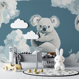Kids bedroom featuring koala wall mural above a cozy reading nook