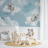 Koala nursery wallpaper creating a peaceful atmosphere in a modern nursery with white furniture