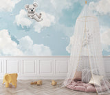 Dreamy koala wallpaper installed in a baby's room with natural decor