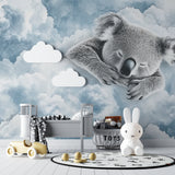 Dreamy koala wallpaper brightening a child's reading nook with plush seating