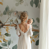 Koala and eucalyptus mural creating a calming atmosphere in a baby's room