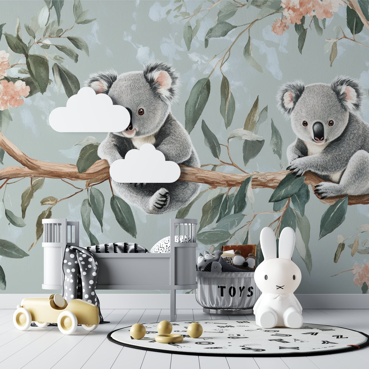 Baby room with koala wall mural showing pink and sage green color harmony
