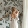 Koala wallpaper in bright nursery with white crib and gentle morning light