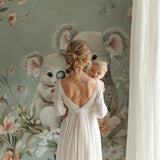 Sweet koala mural wallpaper creating a reading nook in a children's bedroom