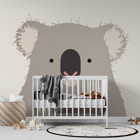 Modern Koala wallpaper mural styled in a bright nursery with white furniture and natural accents