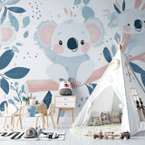 Woodland nursery wallpaper featuring koalas in a minimalist nursery with white crib
