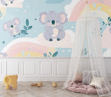 Pastel rainbow koala wallpaper in a gender-neutral nursery with gray and white decor