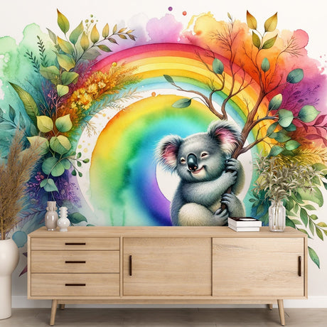 Koala rainbow wallpaper creating a magical atmosphere in a bright nursery with white furniture and natural light
