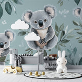 Sage green koala wallpaper creating a cozy reading nook in a children's bedroom
