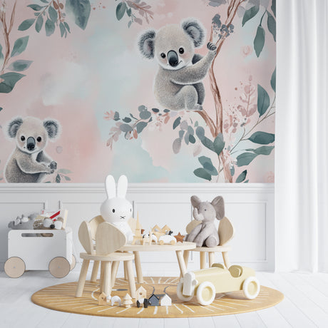Koala nursery wallpaper in a bright modern nursery with white furniture and natural decor