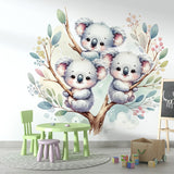 Sweet Koala wallpaper mural styled in a bright nursery with white furniture and soft pink accents