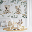 Koala wallpaper mural creating a peaceful atmosphere in a bright nursery with white furniture
