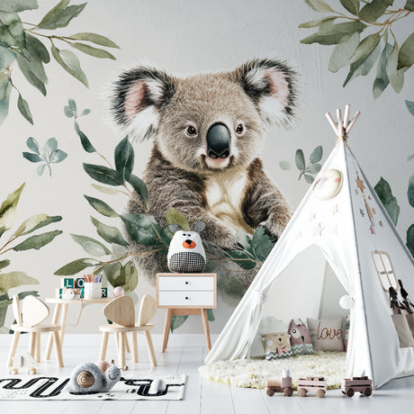 Koala wallpaper mural creating a peaceful atmosphere in a modern nursery with white furniture