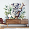 Koala wallpaper mural creating a peaceful atmosphere in a modern nursery with natural wood furniture