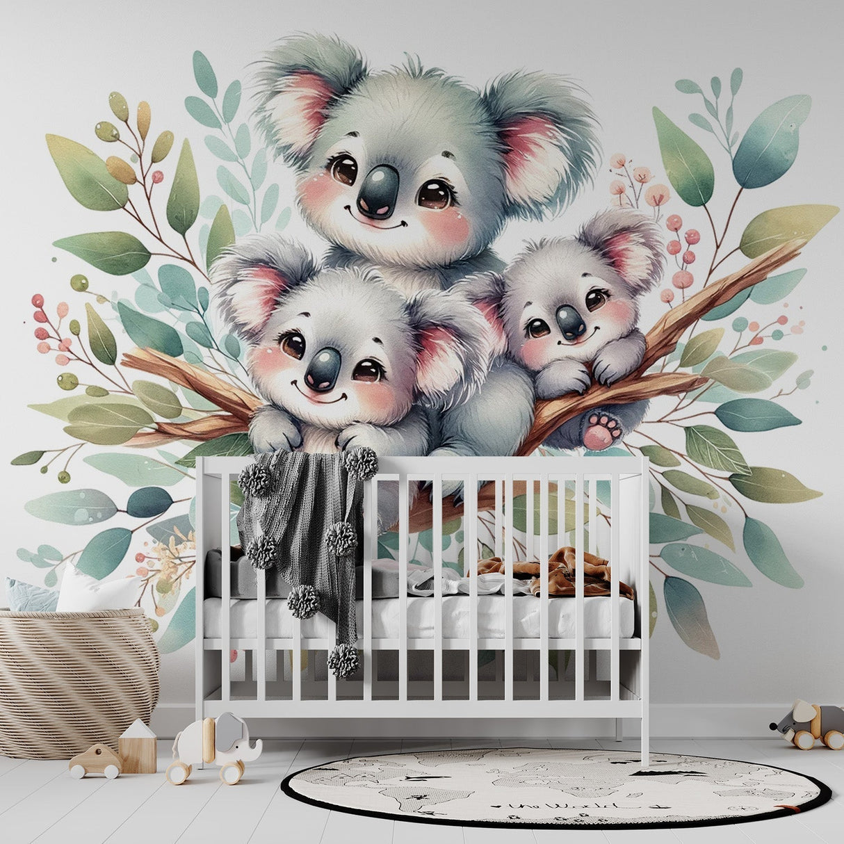Koala family wallpaper mural in a bright nursery setting, showing three cute koalas among watercolor leaves